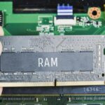 ram random access memory ddr4 technician hand with laptop motherboard background 41472 967